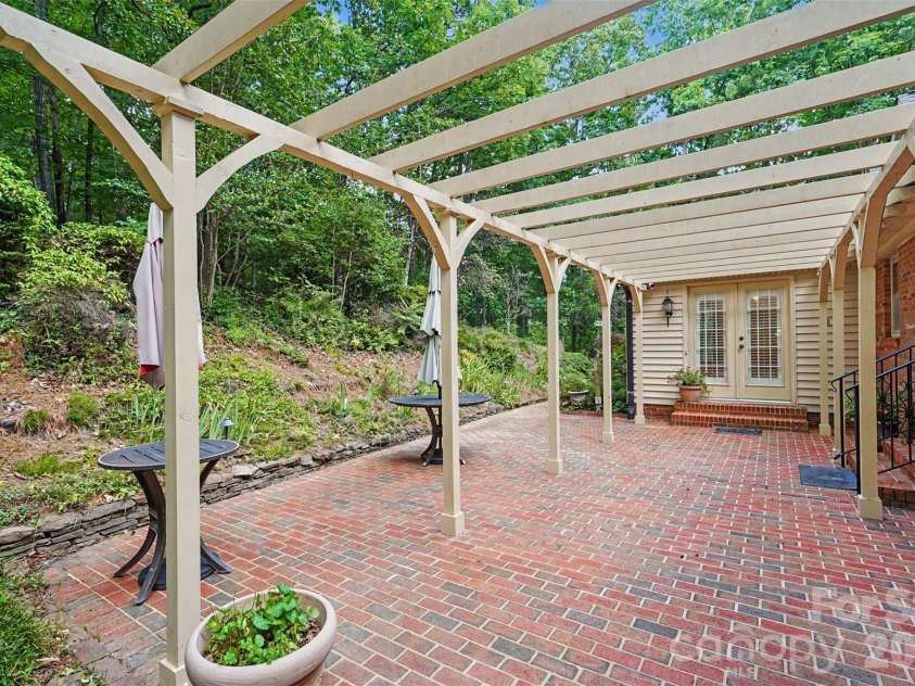 215 Chedworth Court, Concord, NC 28025.  MLS# CAR4396675, YatesRealty ID 33737. Private back brick patio