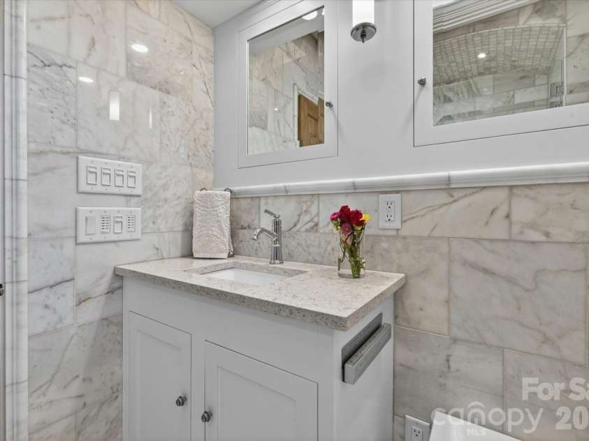 1035 Queens Road, Charlotte, NC 28207.  MLS# CAR4389224, YatesRealty ID 33738. Beveled Mirrors on Bathroom Cabinets