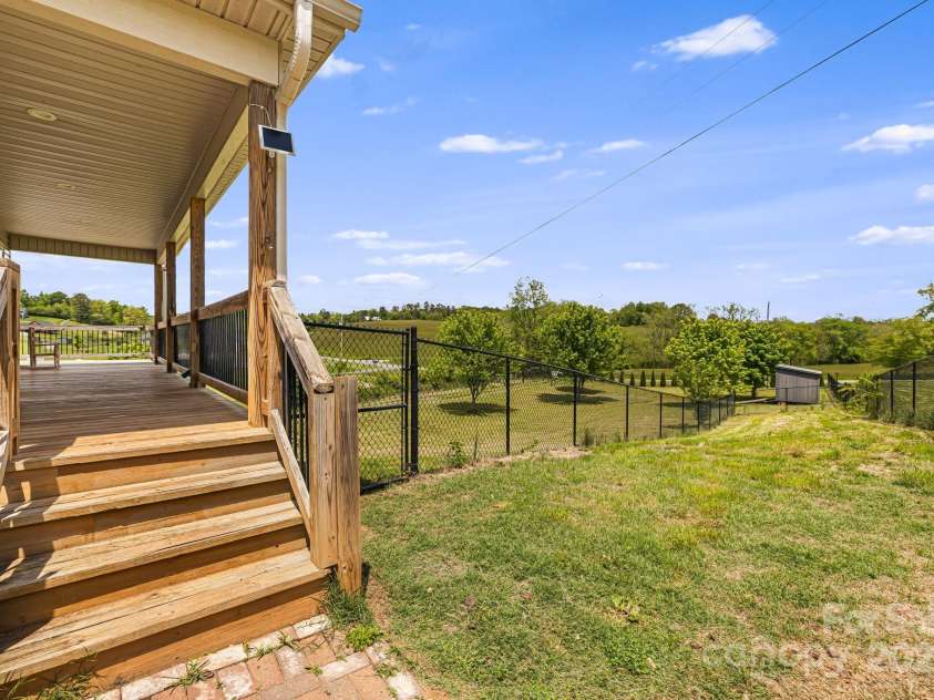 742 Old NC 20 Highway, Alexander, NC 28701.  MLS# CAR4249395, YatesRealty ID 33751. Access to smaller fenced yard portion