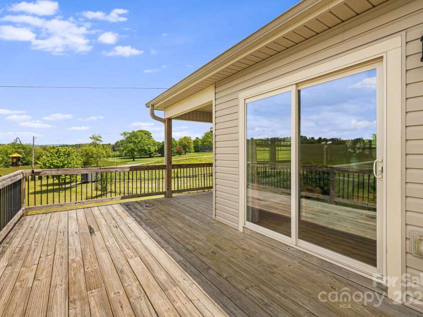 742 Old NC 20 Highway, Alexander, NC 28701.  MLS# CAR4249395, YatesRealty ID 33751. Deck w/access to dining area