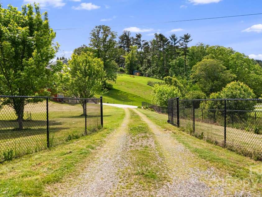 742 Old NC 20 Highway, Alexander, NC 28701.  MLS# CAR4249395, YatesRealty ID 33751. Driveway leading to property