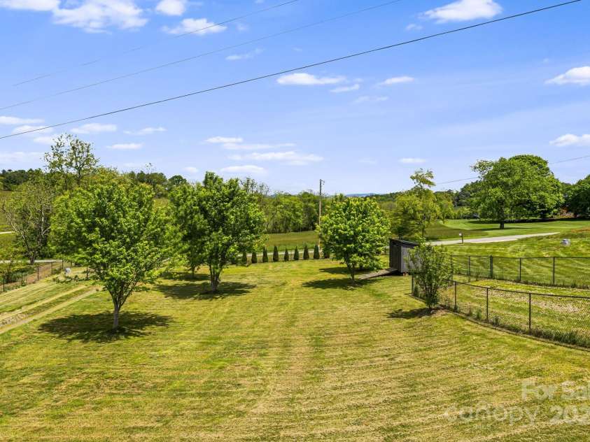742 Old NC 20 Highway, Alexander, NC 28701.  MLS# CAR4249395, YatesRealty ID 33751. Spacious yard with trees