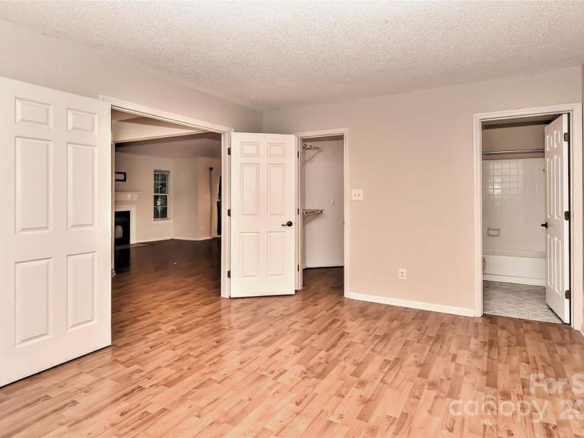 6500 Clavell Lane, Charlotte, NC 28210.  MLS# CAR4289455, YatesRealty ID 33760. Another view of bedroom 1 w/double doors, full bath attached and nice size walk in closet.