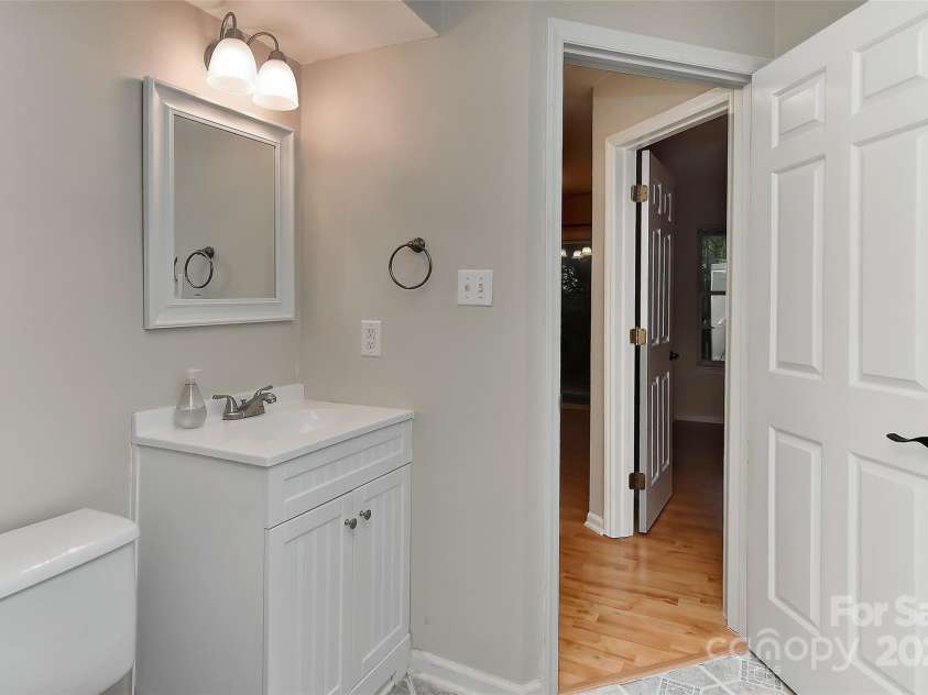 6500 Clavell Lane, Charlotte, NC 28210.  MLS# CAR4289455, YatesRealty ID 33760. Bath 2 attached to main living area and bedroom 2.  Bath flooring replaced 2021.