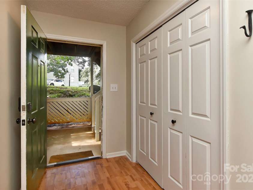 6500 Clavell Lane, Charlotte, NC 28210.  MLS# CAR4289455, YatesRealty ID 33760. Private entry with big storage/coat closet at front door.