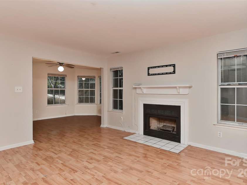 6500 Clavell Lane, Charlotte, NC 28210.  MLS# CAR4289455, YatesRealty ID 33760. The living room open to office/sunroom or flex space- what fits your needs?