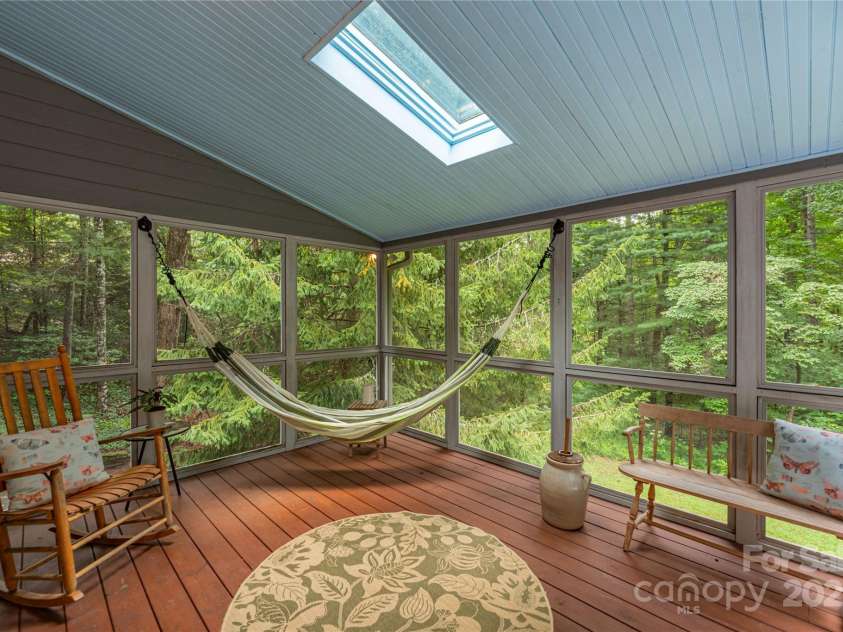 11 Claremont Drive, Flat Rock, NC 28731.  MLS# CAR4289127, YatesRealty ID 33763. Inviting Screened Porch