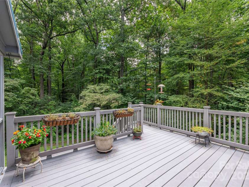 11 Claremont Drive, Flat Rock, NC 28731.  MLS# CAR4289127, YatesRealty ID 33763. Open Deck with Wooded Views