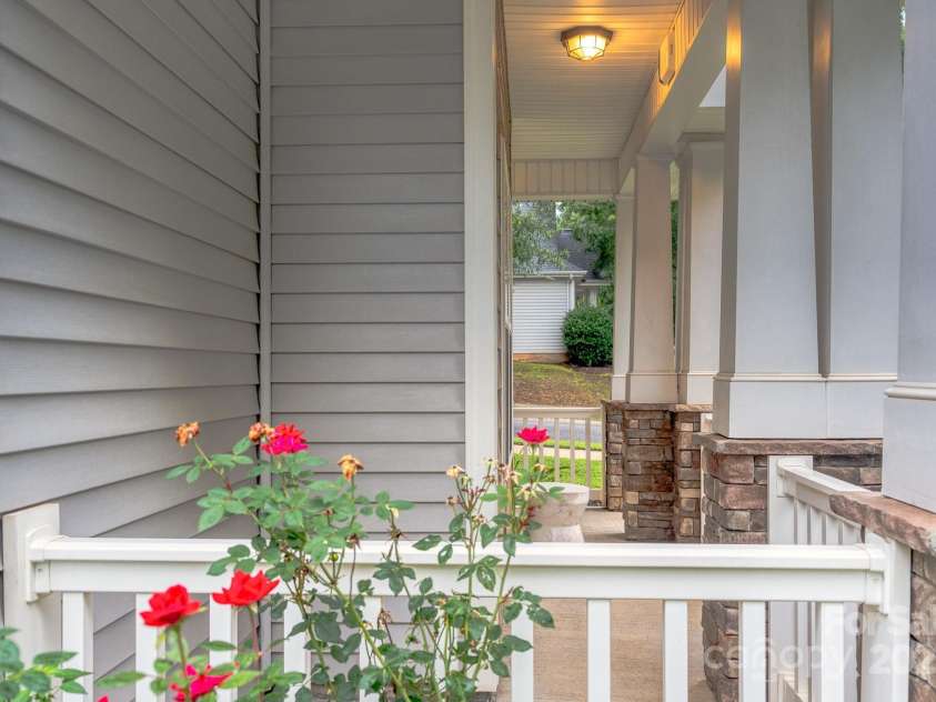 6402 Colonial Garden Drive, Huntersville, NC 28078.  MLS# CAR4291074, YatesRealty ID 33770. Charming rocking chair front porch.