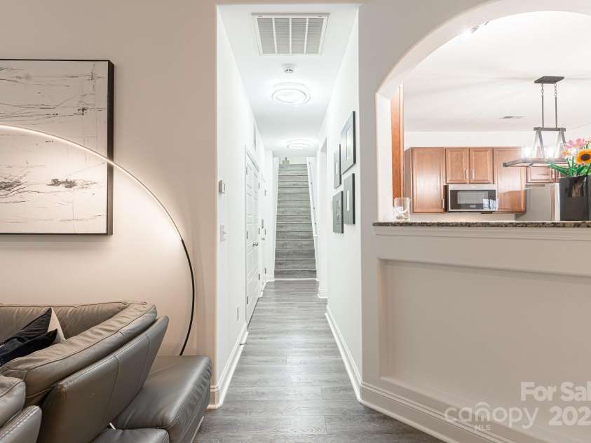 6402 Colonial Garden Drive, Huntersville, NC 28078.  MLS# CAR4291074, YatesRealty ID 33770. Hallway to garage, upstairs 4th bedroom and primary suite.