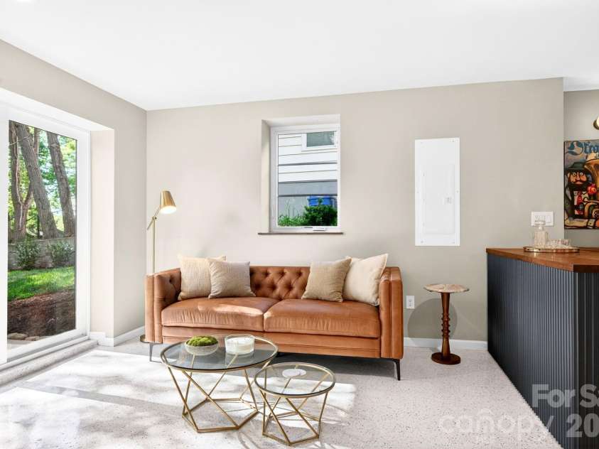 4 Baird Lane, Asheville, NC 28804.  MLS# CAR4380981, YatesRealty ID 33771. Basement Living Room w/ Easy Access to Backyard