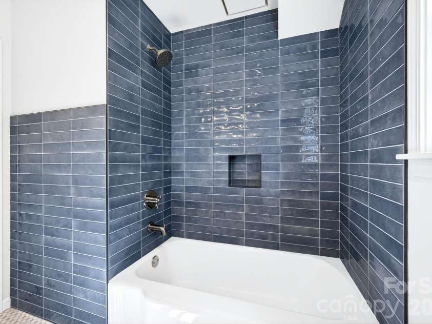 4 Baird Lane, Asheville, NC 28804.  MLS# CAR4380981, YatesRealty ID 33771. Beautiful tile surround