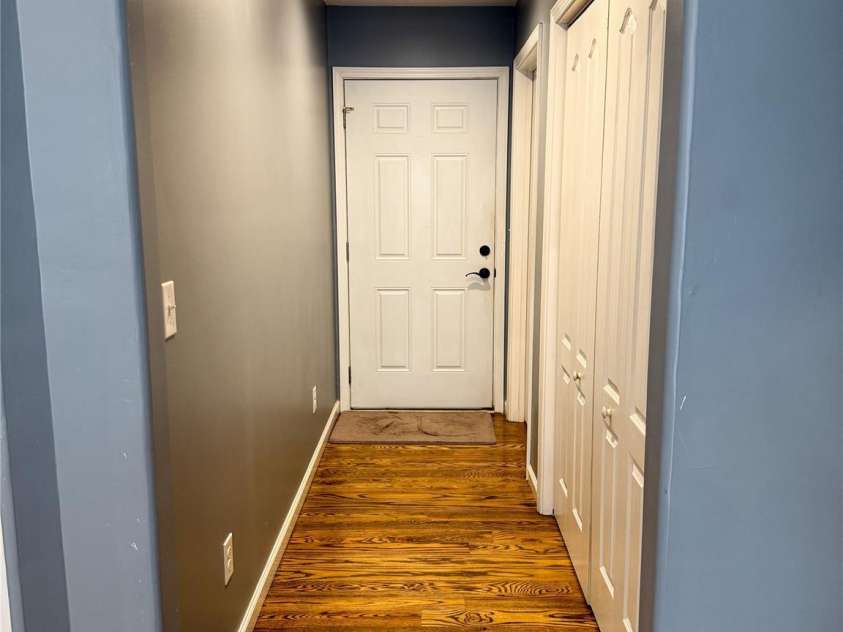 2302 Saratoga Run, Morganton, NC 28655.  MLS# CAR4292402, YatesRealty ID 33773. Hallway with main floor laundry, plus access to garage and steps to basement