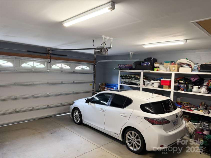 2302 Saratoga Run, Morganton, NC 28655.  MLS# CAR4292402, YatesRealty ID 33773. Two car garage with built-in shelving