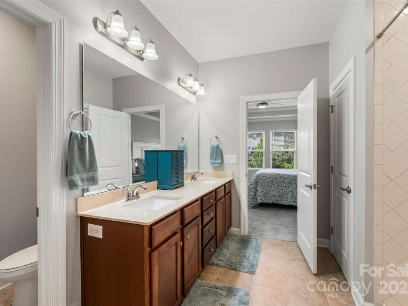 5012 Laurel Glen Court, Monroe, NC 28110.  MLS# CAR4292898, YatesRealty ID 33778. Primary Bathroom with double vanity and walk in tile shower 