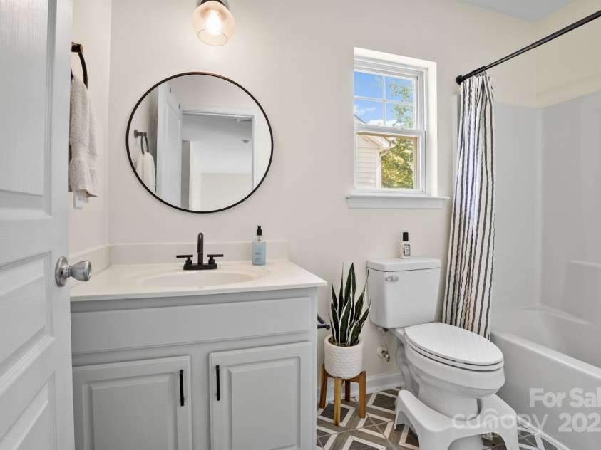 10636 Secret Garden Lane, Charlotte, NC 28214.  MLS# CAR4293373, YatesRealty ID 33785. Full hall bath serves the secondary bedrooms