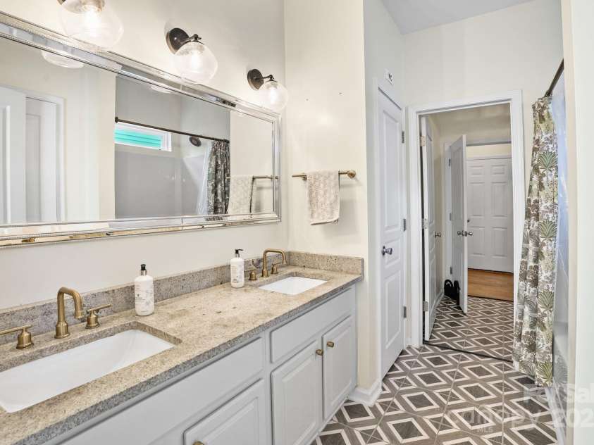 10636 Secret Garden Lane, Charlotte, NC 28214.  MLS# CAR4293373, YatesRealty ID 33785. Granite-topped vanity in the primary bath