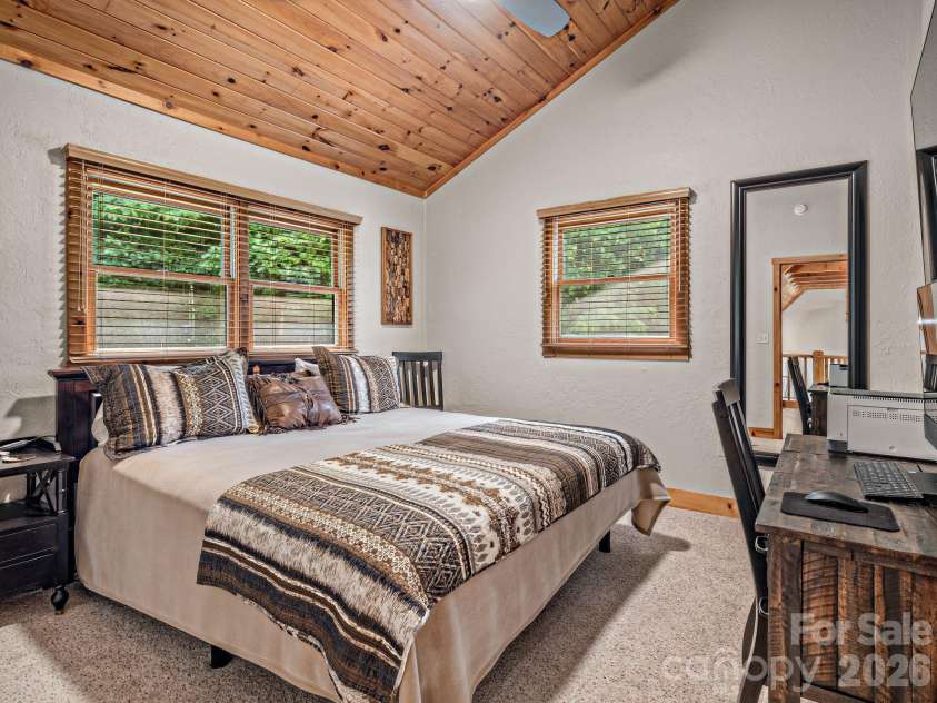 59 Canoe Creek Drive, Tuckasegee, NC 28783.  MLS# CAR4396318, YatesRealty ID 33786. Spacious second bedroom located on the upper level.