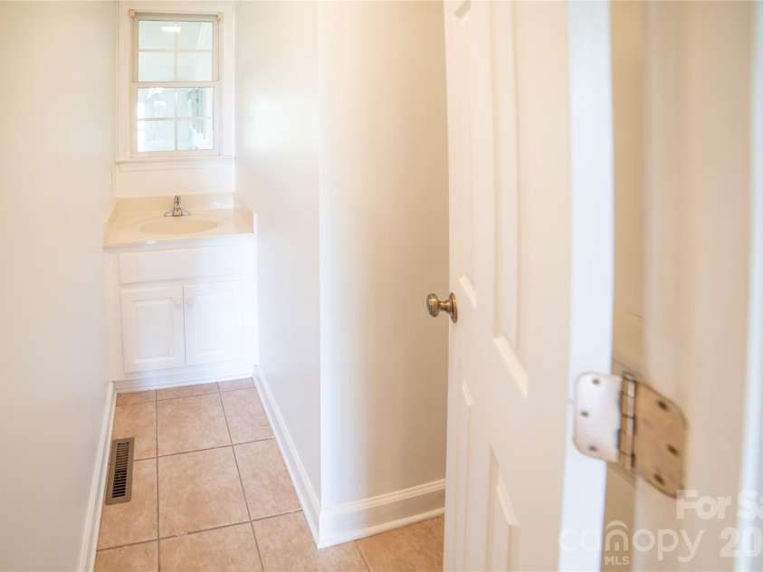 1421 Windsor Street, Lenoir, NC 28645.  MLS# CAR4372001, YatesRealty ID 33788. Main level half bath