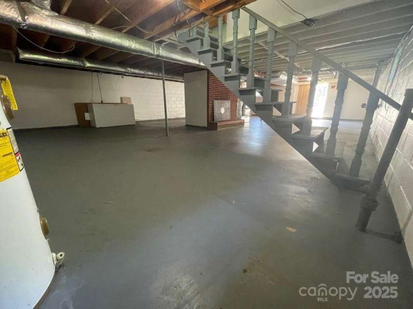 2450 Poors Ford Road, Rutherfordton, NC 28139.  MLS# CAR4284856, YatesRealty ID 33788. Basement with fire place