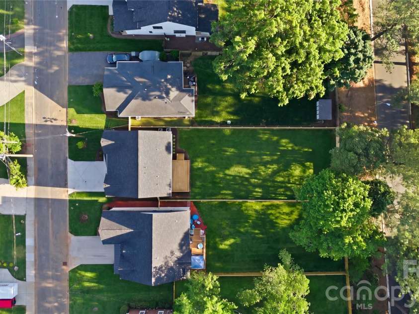 1637 Longfellow Street, Charlotte, NC 28205.  MLS# CAR4346623, YatesRealty ID 3379. Aerial property view. ote: The lawn has been recently seeded, and photography has been digitally enhanced to represent the yard at full, established growth.