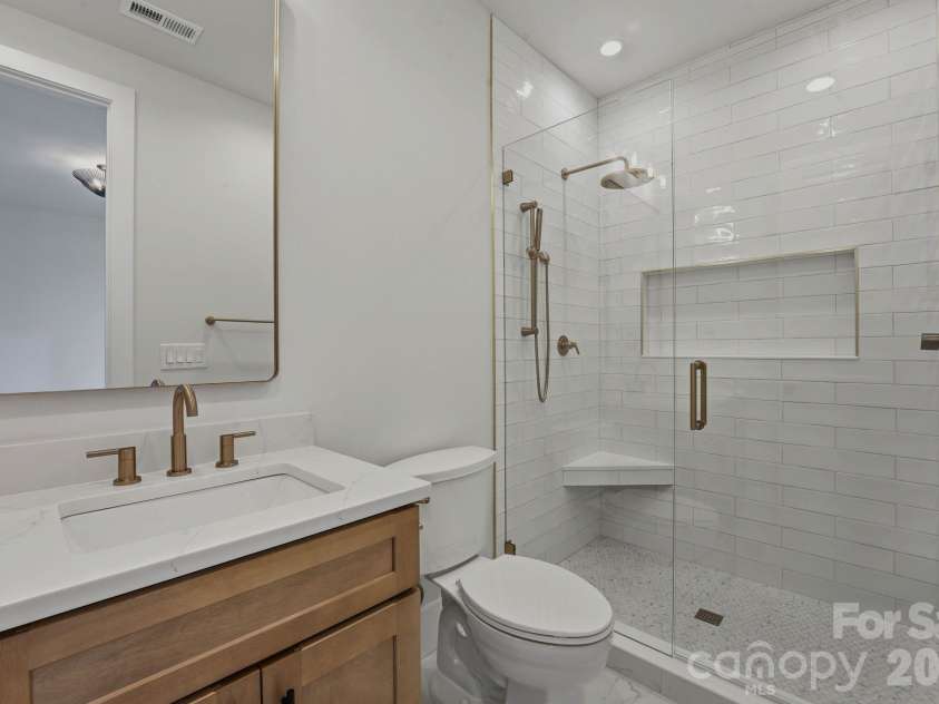 1637 Longfellow Street, Charlotte, NC 28205.  MLS# CAR4346623, YatesRealty ID 3379. Ensuite bathroom in guest bedroom one.