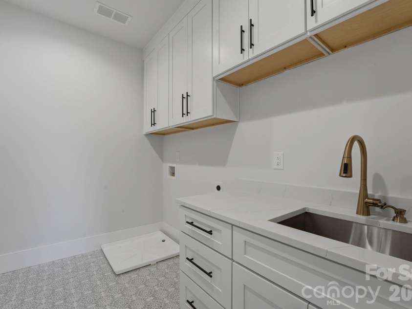 1637 Longfellow Street, Charlotte, NC 28205.  MLS# CAR4346623, YatesRealty ID 3379. Laundry room, located in upper level hallway.