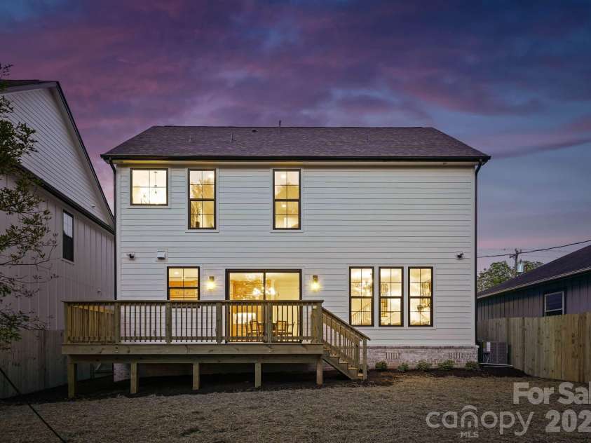 1637 Longfellow Street, Charlotte, NC 28205.  MLS# CAR4346623, YatesRealty ID 3379. Rear view at twilight.