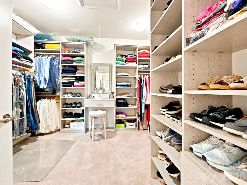 1726 Tailed Hawk Way, Fort Mill, SC 29715.  MLS# CAR4394570, YatesRealty ID 33796. Amazing master closet with custom shelving plus vanity