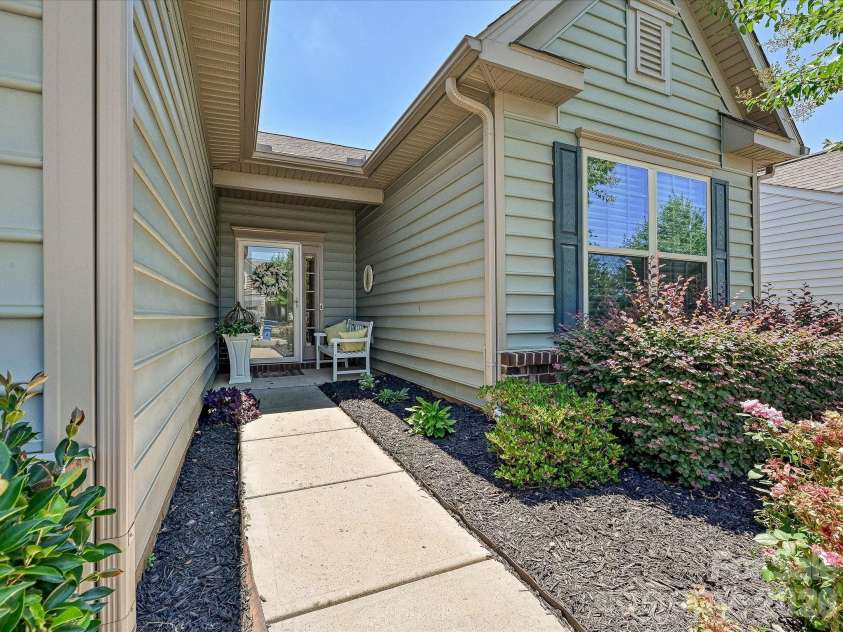 1726 Tailed Hawk Way, Fort Mill, SC 29715.  MLS# CAR4394570, YatesRealty ID 33796. Recessed entry has room for garden bench