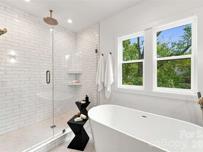 4337 Castleton Road, Charlotte, NC 28211.  MLS# CAR4329159, YatesRealty ID 33798. Primary bathroom with a walk in shower and soak in tbu