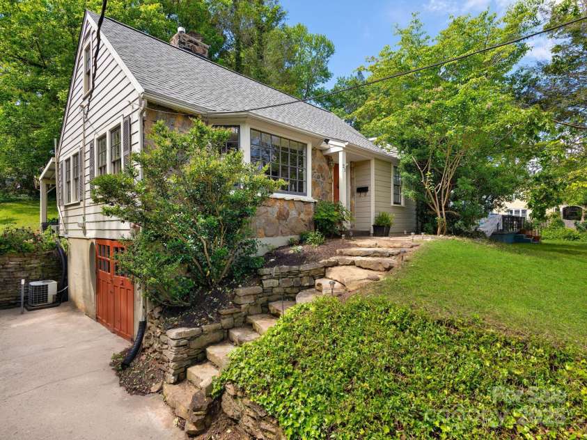 21 Clairmont Avenue, Asheville, NC 28804.  MLS# CAR4251719, YatesRealty ID 33799. Charming North Asheville Stone Cottage!
