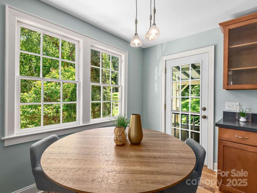 21 Clairmont Avenue, Asheville, NC 28804.  MLS# CAR4251719, YatesRealty ID 33799. Dining space with direct access to back deck for easy indoor-outdoor living