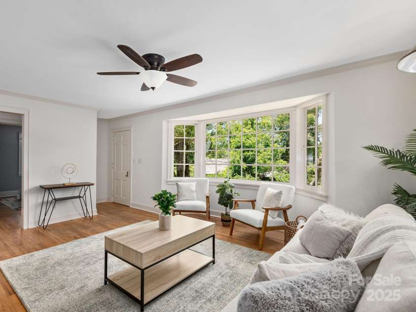21 Clairmont Avenue, Asheville, NC 28804.  MLS# CAR4251719, YatesRealty ID 33799. Inviting home with large bay window in living room pours natural light into main floor spaces