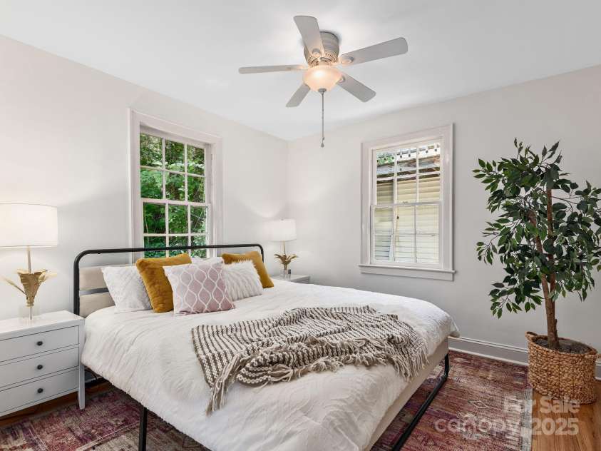 21 Clairmont Avenue, Asheville, NC 28804.  MLS# CAR4251719, YatesRealty ID 33799. Primary bedroom on the main level with ample natural light