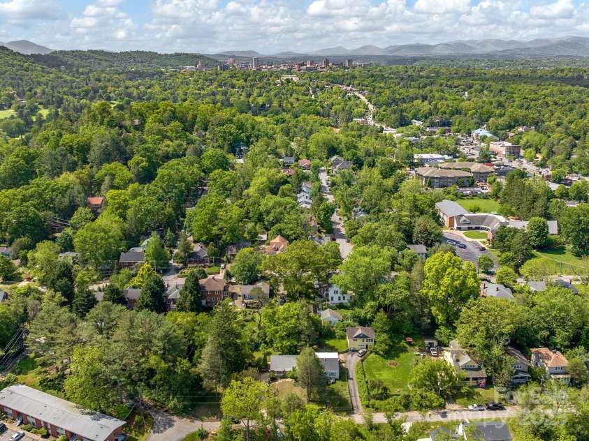 21 Clairmont Avenue, Asheville, NC 28804.  MLS# CAR4251719, YatesRealty ID 33799. Set beautifully behind Downtown Asheville and surrounded by the mountains