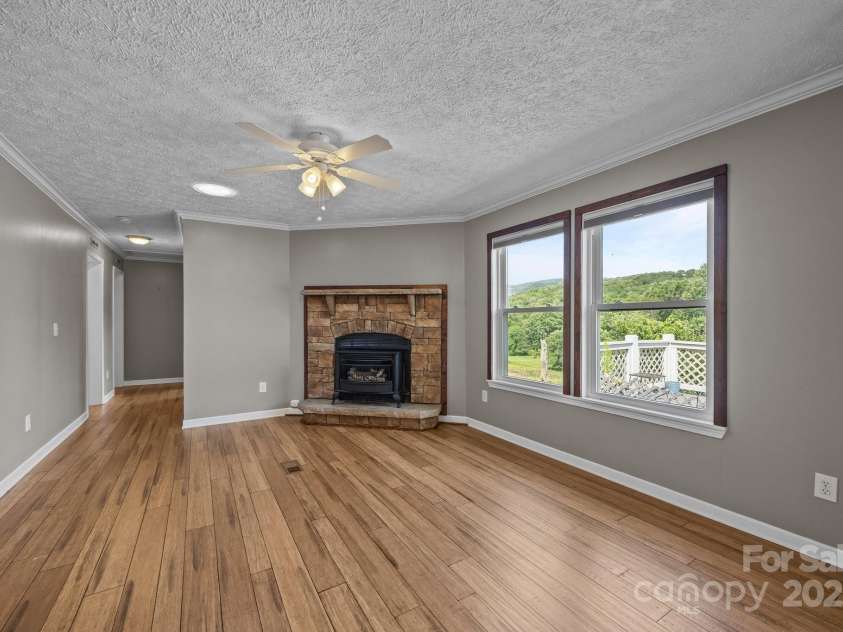 382 Onteora Boulevard, Asheville, NC 28803.  MLS# CAR4272620, YatesRealty ID 3380. Huge den with fireplace.