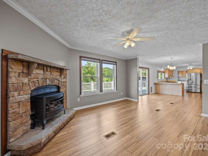 382 Onteora Boulevard, Asheville, NC 28803.  MLS# CAR4272620, YatesRealty ID 3380. View from the end of the Den back through the Dining Area to the Kitchen