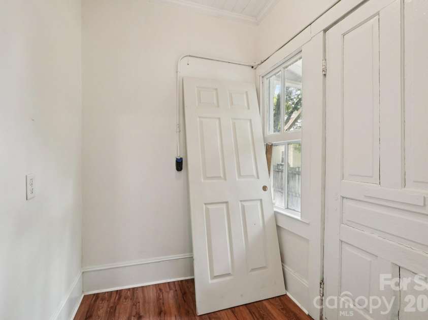105 Houston Street, Monroe, NC 28112.  MLS# CAR4396106, YatesRealty ID 33807. Primary Unit: Dedicated laundry room offering everyday convenience and additional storage potential.