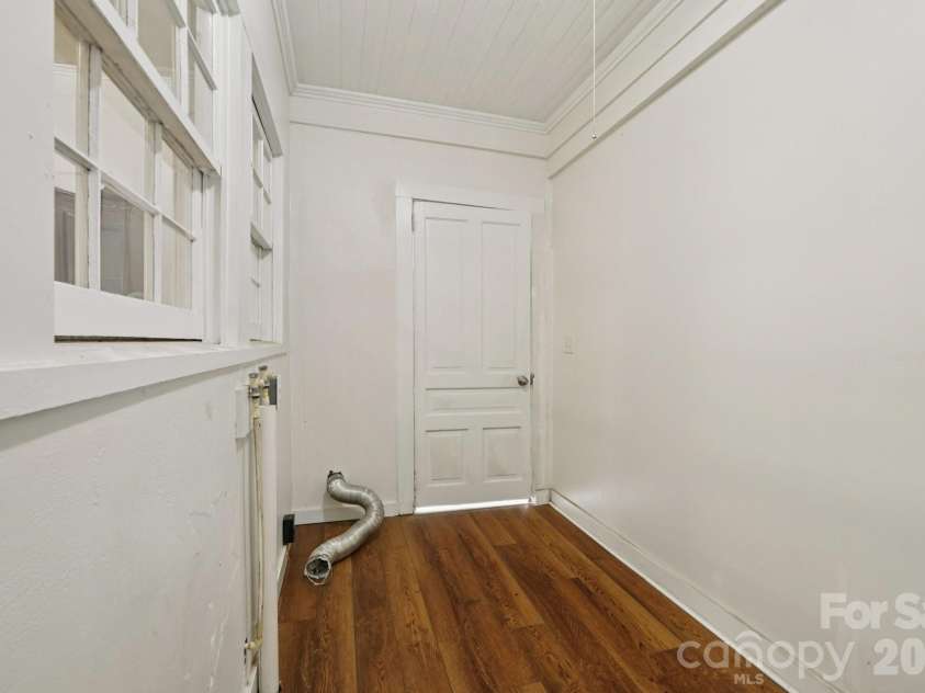 105 Houston Street, Monroe, NC 28112.  MLS# CAR4396106, YatesRealty ID 33807. Secondary Unit: Dedicated laundry room providing everyday convenience and additional storage opportunities.
