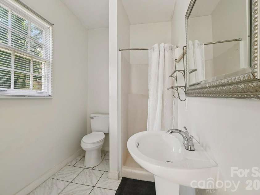 105 Houston Street, Monroe, NC 28112.  MLS# CAR4396106, YatesRealty ID 33807. Secondary Unit: Full bathroom conveniently serving the Secondary Unit.