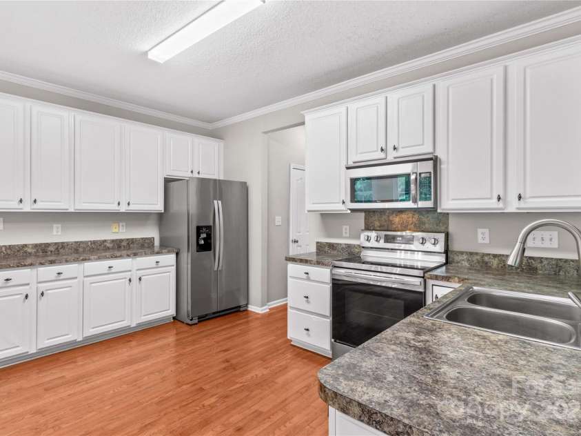 145 Summerbrook Lane, Mooresville, NC 28117.  MLS# CAR4280229, YatesRealty ID 33808. Kitchen with cabinet storage