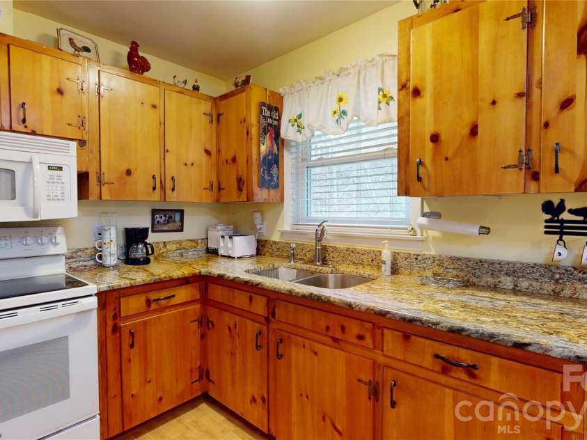 979 Greenville Highway, Brevard, NC 28712.  MLS# CAR4338067, YatesRealty ID 33808. Ample counterspace makes preparing meals easy.