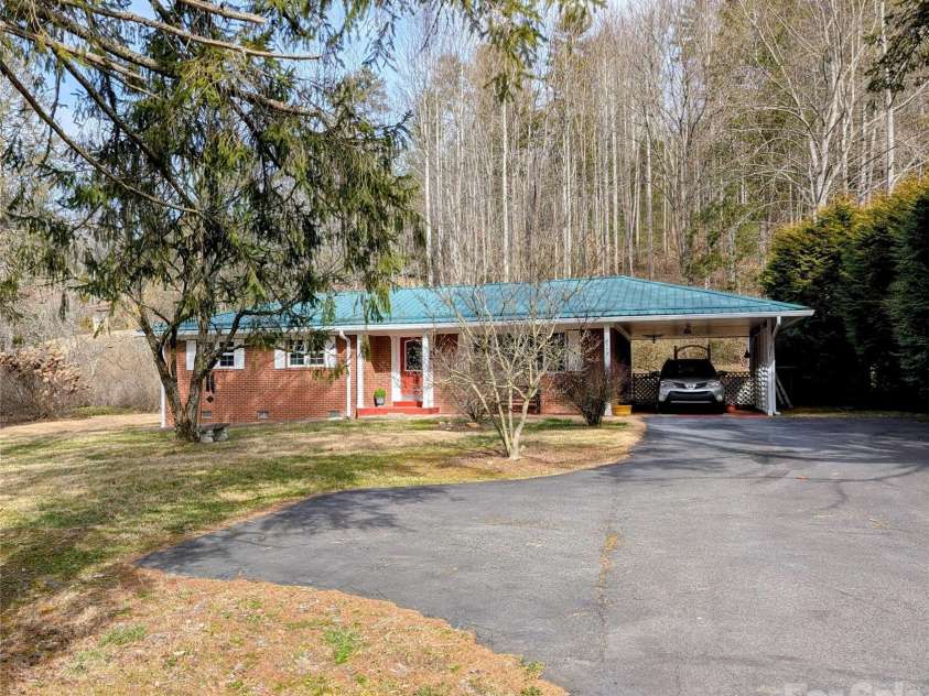 979 Greenville Highway, Brevard, NC 28712.  MLS# CAR4338067, YatesRealty ID 33808. Covered car port and ample parking.