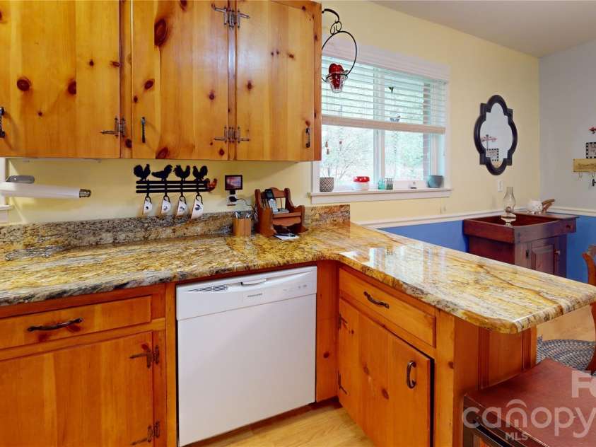 979 Greenville Highway, Brevard, NC 28712.  MLS# CAR4338067, YatesRealty ID 33808. Kitchen features updated appliances and granite countertops.