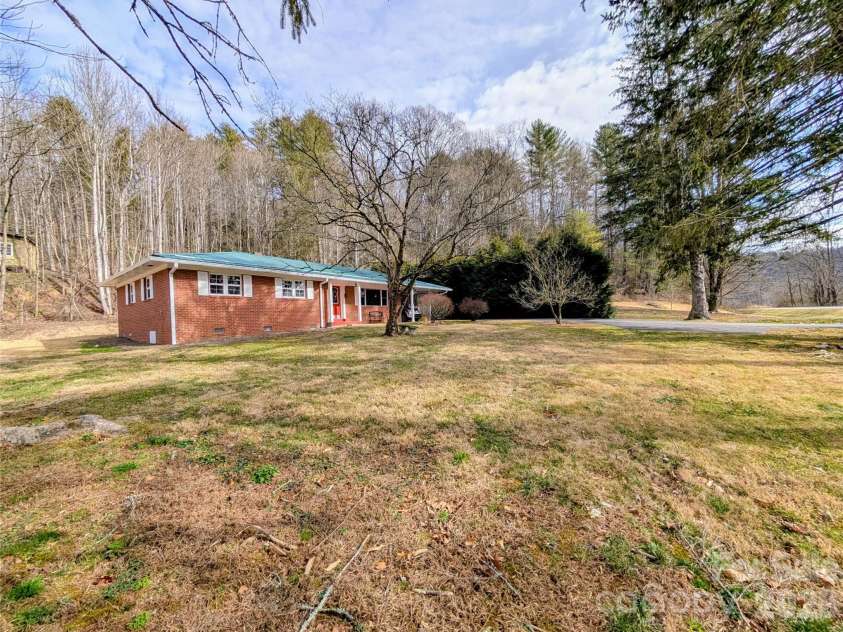 979 Greenville Highway, Brevard, NC 28712.  MLS# CAR4338067, YatesRealty ID 33808. Large level front yard.