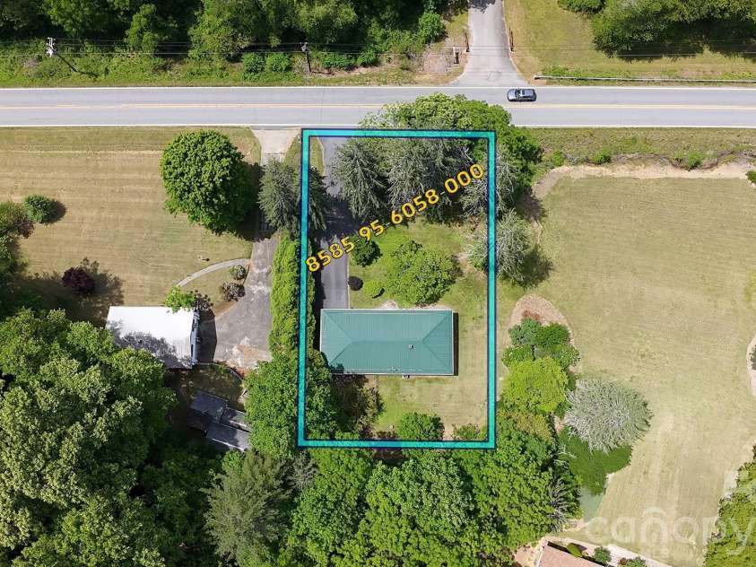979 Greenville Highway, Brevard, NC 28712.  MLS# CAR4338067, YatesRealty ID 33808. Nice-size lot with mature trees.