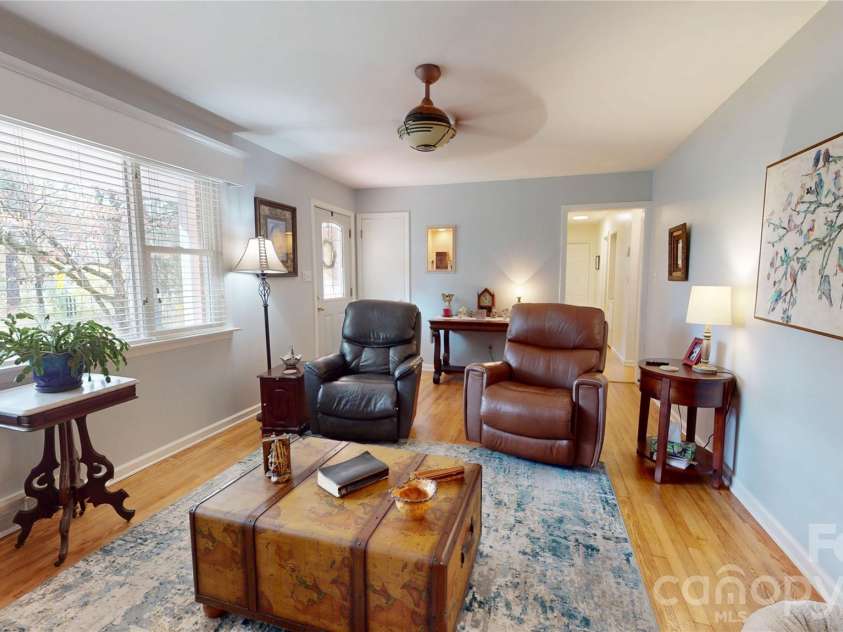 979 Greenville Highway, Brevard, NC 28712.  MLS# CAR4338067, YatesRealty ID 33808. Spacious, well-lit living room.