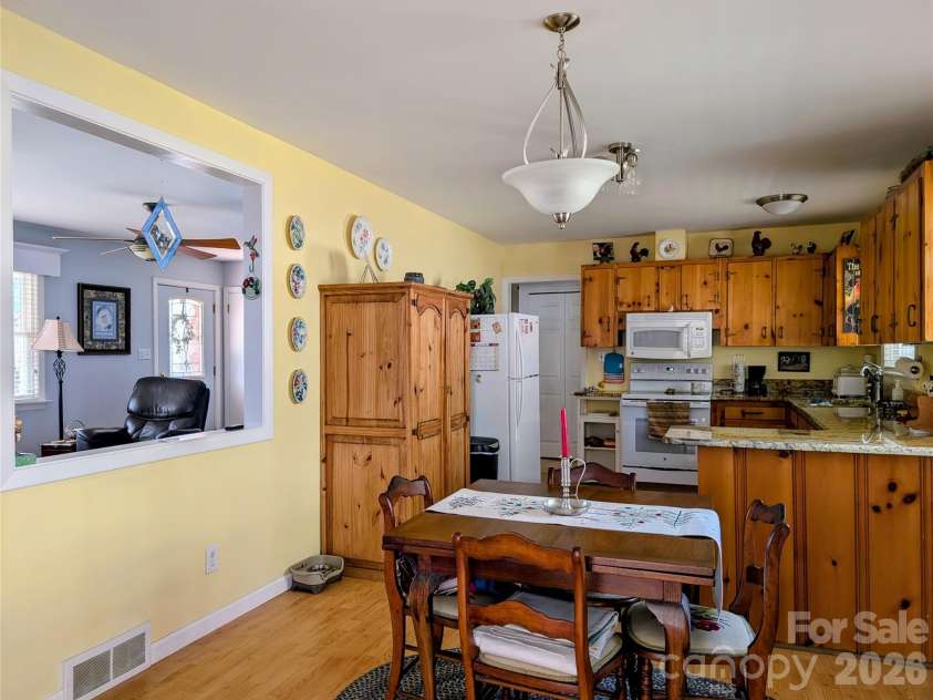 979 Greenville Highway, Brevard, NC 28712.  MLS# CAR4338067, YatesRealty ID 33808. Wall opening connects rooms.
