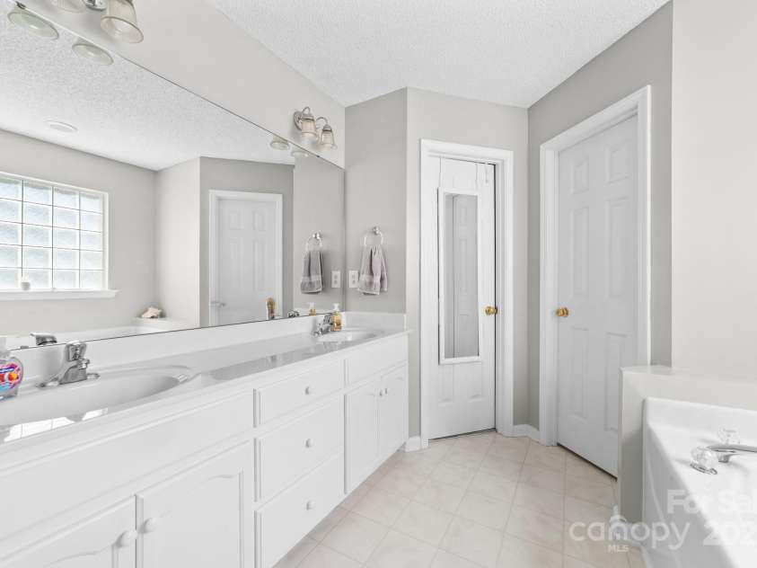 221 Deerfield Drive, Mount Holly, NC 28120.  MLS# CAR4280718, YatesRealty ID 33809. Primary bathroom.